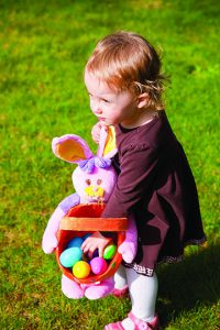 Kid at an Easter egg hunt