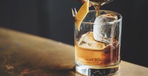 liquor barn: glass of bourbon with an orange twist