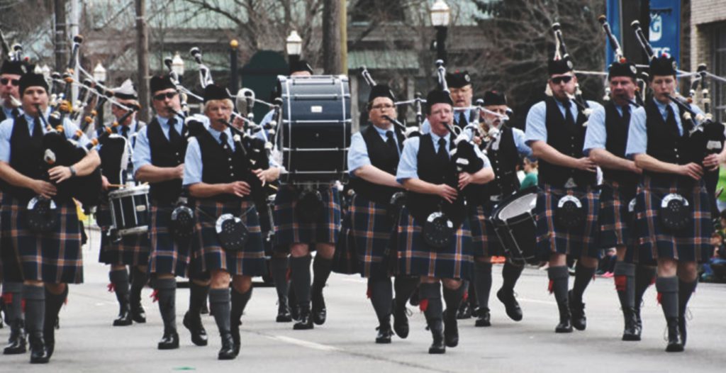 band playing bagpipes in parade