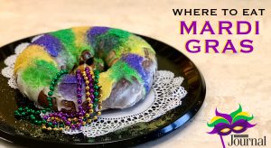 mardi gras: king cake with purple, green, and yellow icing and beads