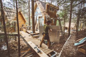 Django Kroner working on a treehouse