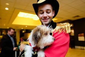 pets: a man dressed as a ring leader with a dog