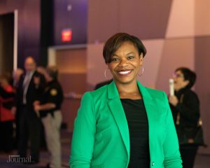 Lexington: woman in a green blazer smiling at the camera