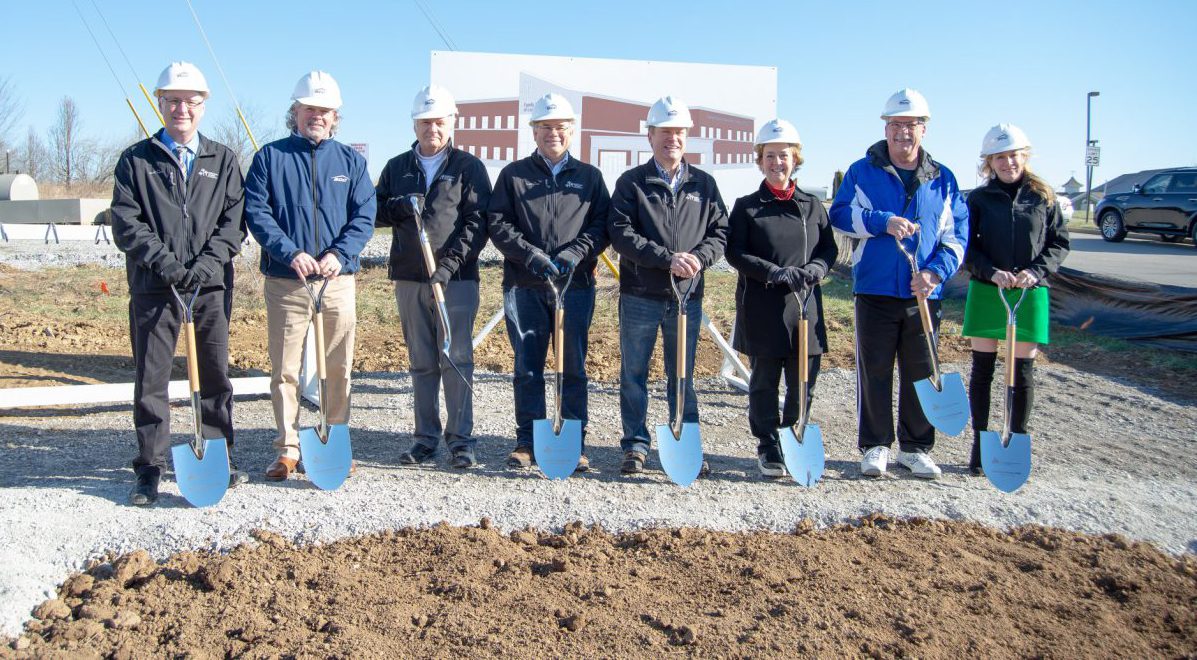 business news: group of people with shovels posing for a picture