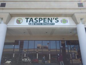 Business: front face of a building that has a sign that says Taspen's