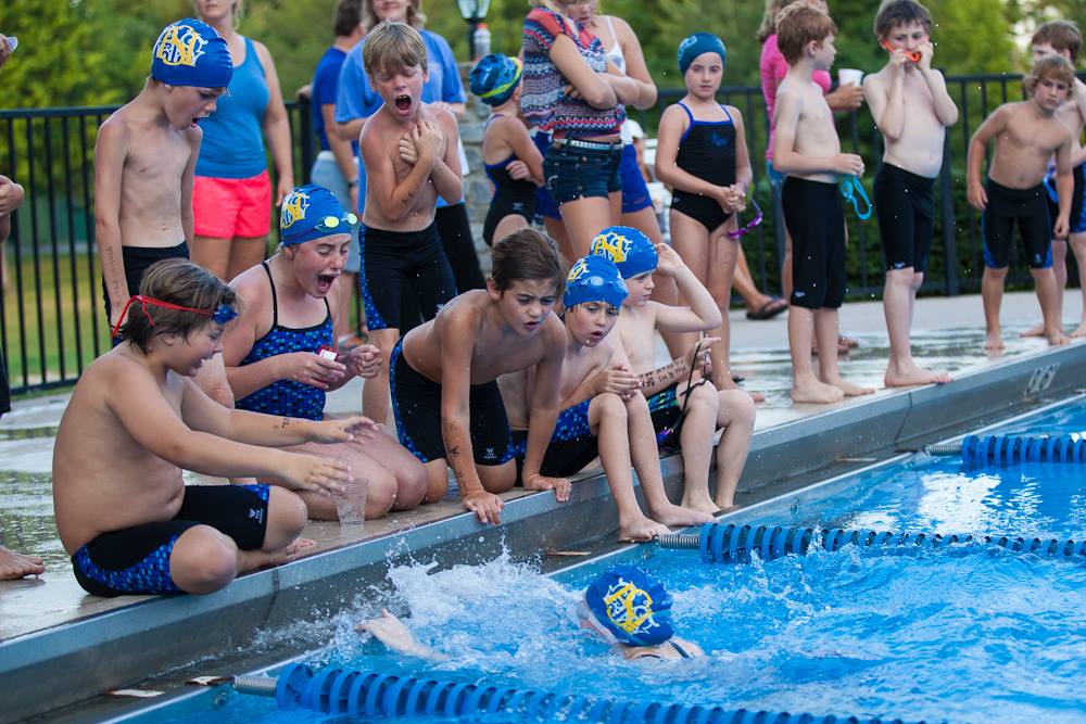Camps: group of kids competing in swimming