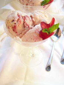cup of strawberry ice cream with strawberries