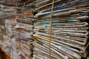 Paper Recycling: a stack of newspaper tied by string