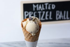 Graeter's Ice Cream: ice cream cone with a chalk board in the back ground