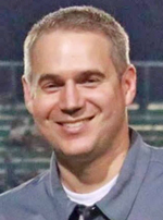 Parents: a man in a gray polo smiling at the camera