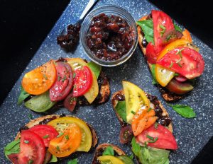 B.L.T.: tomatoes and jam on a board