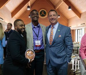 Small Business: three men smiling at the camera holding an award