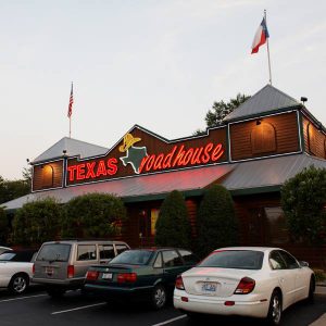 restaurant with Texas Roadhouse in red letters
