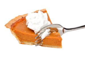Holiday: pumpkin pie with a fork going through it