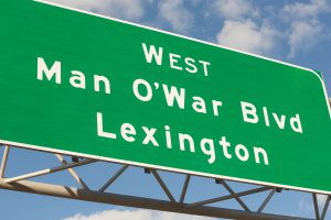 green sign that says Man O' War Boulevard