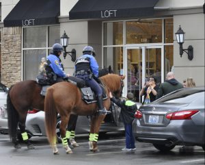 Neighborhood: police horse unit with civilians